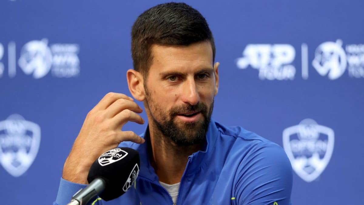 Novak falls in doubles in 1st U.S. match since 21