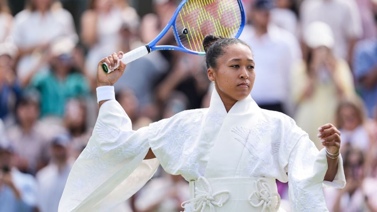 Naomi Osaka within Wimbledon dress code with all white kimono outfit
